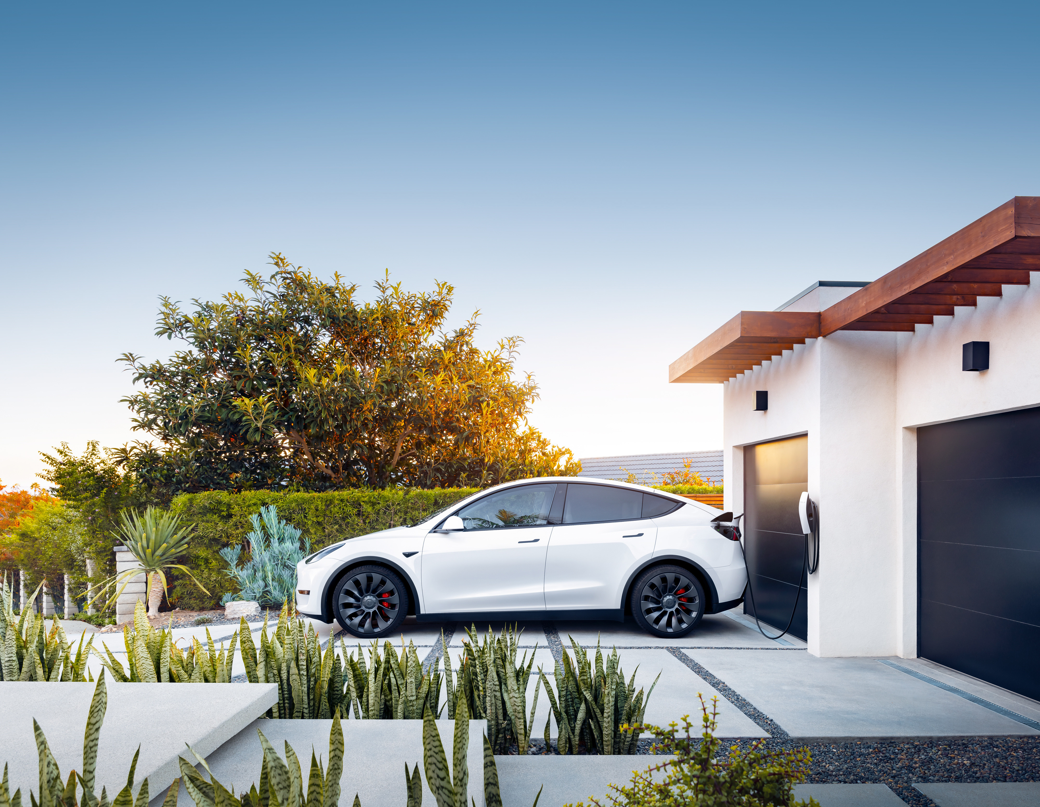 Tesla Wall Connector installed at a modern home