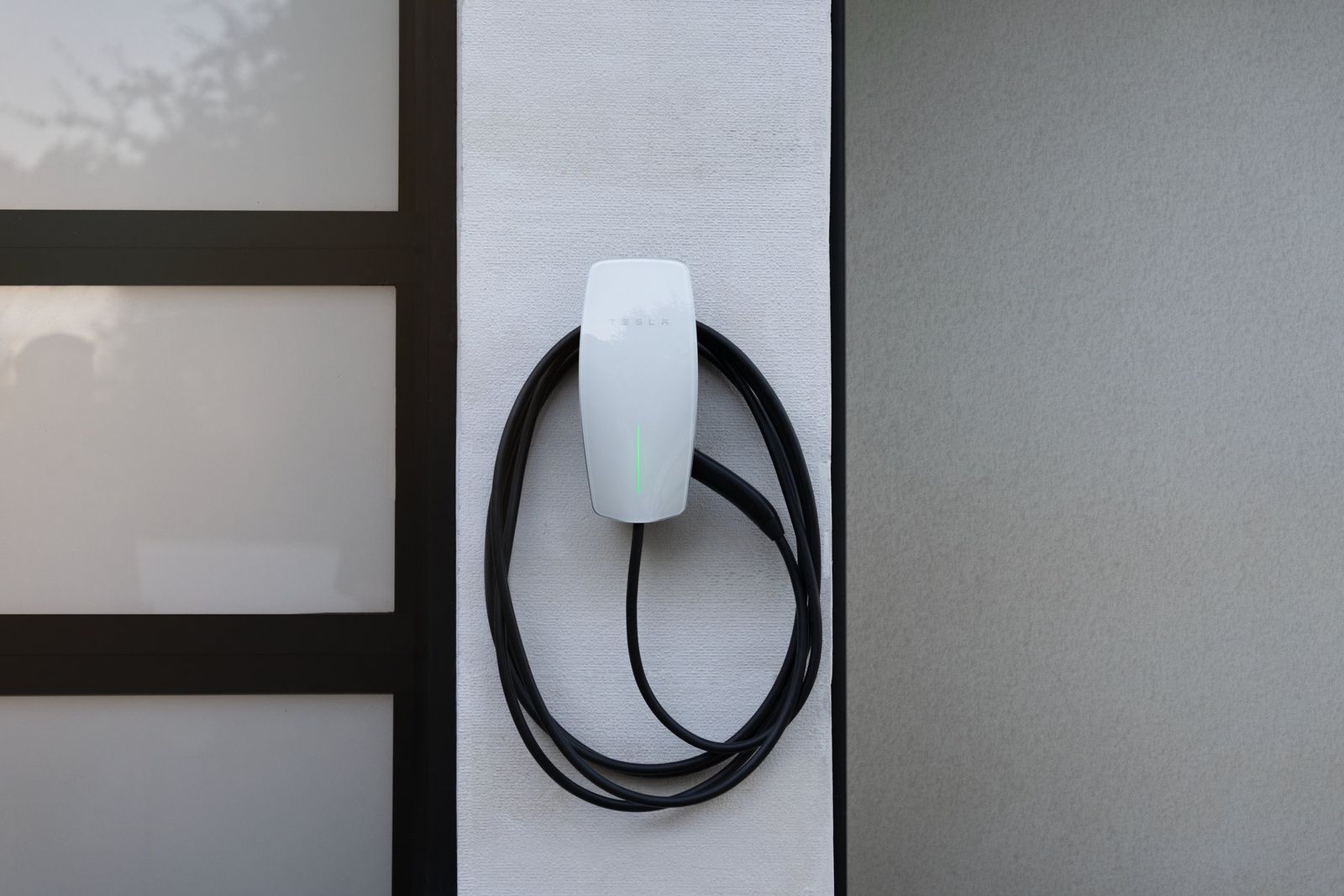Tesla Wall Connector mounted on a wall